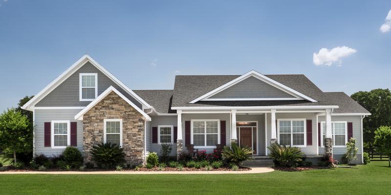 Single-story home with a covered entrance and front-facing windows.